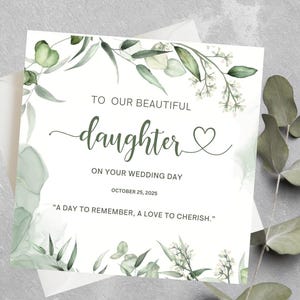 以下が含まれることがあります： 「TO OUR BEAUTIFUL daughter ON YOUR WEDDING DAY OCTOBER 25, 2025」と緑色の筆記体で書かれたウェディングカード。カードは水彩画のユーカリの葉で装飾され、「A DAY TO REMEMBER, A LOVE TO CHERISH.」という引用句が添えられています。