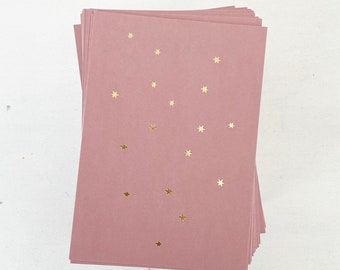 Postkarte Sterne gold auf rosa
