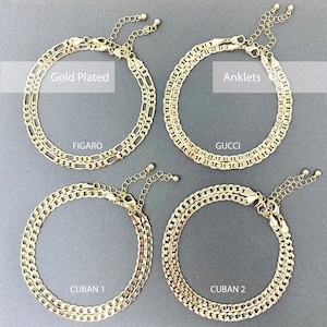 May include: Four gold plated anklets with different chain styles. The anklets are labeled "FIGARO", "GUCCI", "CUBAN 1", and "CUBAN 2". The text "Gold Plated Anklets" is also included in the image.