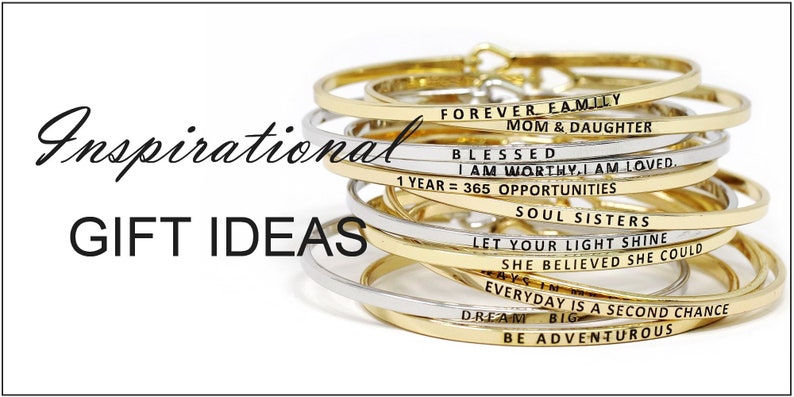 May include: A stack of gold and silver bangle bracelets with inspirational messages engraved on them. The messages include "Forever Family Mom & Daughter", "Blessed I Am Worthy, I Am Loved", "1 Year = 365 Opportunities", "Soul Sisters", "Let Your Light Shine", "She Believed She Could", "Everyday Is A Second Chance", "Dream Big", and "Be Adventurous".