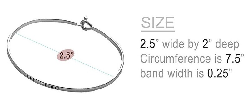 May include: Silver bangle bracelet with the words "Free Spirit" engraved on the front. The bracelet is 2.5 inches wide, 2 inches deep, and has a circumference of 7.5 inches. The band width is 0.25 inches.