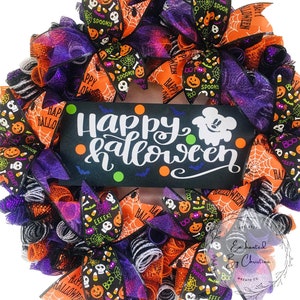 May include: A Halloween wreath with orange, black, purple, and white mesh and ribbons. The wreath features a sign that says "Happy Halloween" with a ghost and bats. The ribbons have various Halloween-themed patterns, including pumpkins, candy corn, skulls, and spiders.