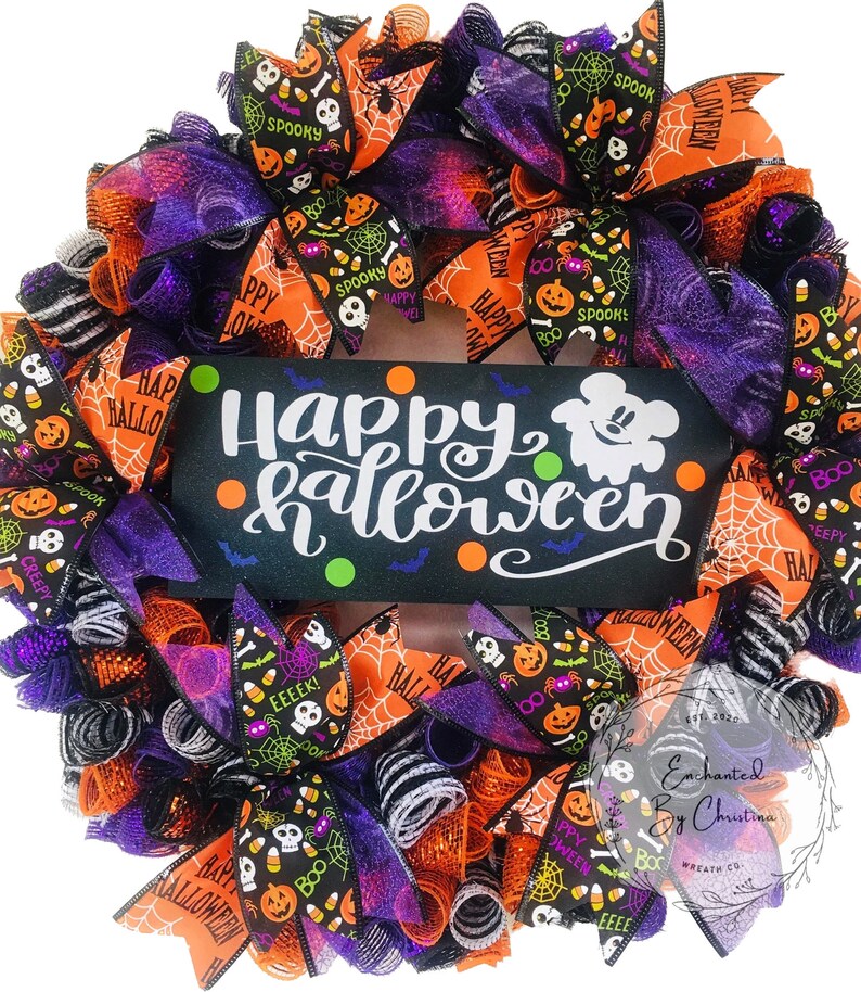 May include: A Halloween wreath with orange, black, purple, and white mesh and ribbons. The wreath features a sign that says "Happy Halloween" with a ghost and bats. The ribbons have various Halloween-themed patterns, including pumpkins, candy corn, skulls, and spiders.