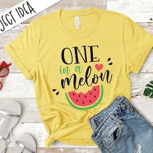 May include: Yellow short-sleeved t-shirt with the text "ONE in a melon" and a watermelon graphic.