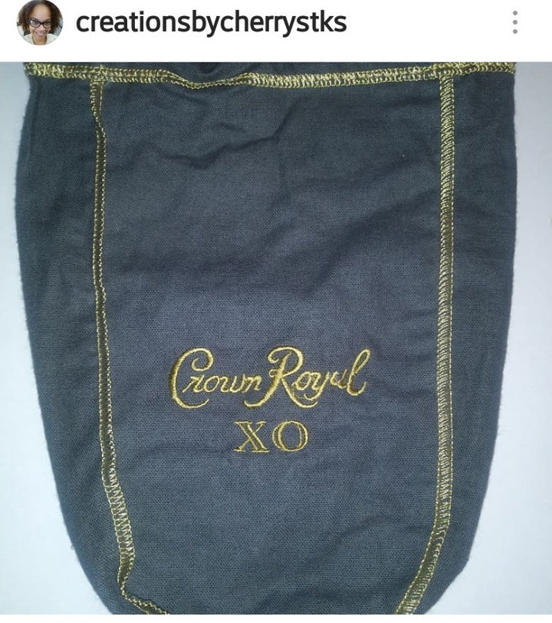 May include: Gray fabric bag with a gold embroidered design that says "Crown Royal XO".
