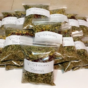 May include: A close-up of multiple small clear plastic bags filled with dried herbs and labeled "V-Steam Blend".