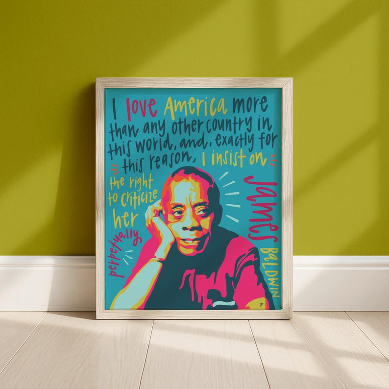 May include: A framed art print featuring a stylized portrait of James Baldwin in shades of pink, dark blue, and yellow. The text reads: I love America more than any other country in this world, and, exactly for this reason, I insist on the right to criticize her perpetually.