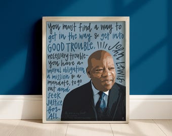 May include: A framed art print featuring a stylized portrait of John Lewis in a dark suit and blue tie, set against a light blue background with dark blue handwritten text that reads: You must find a way to get in the way & get into GOOD TROUBLE.