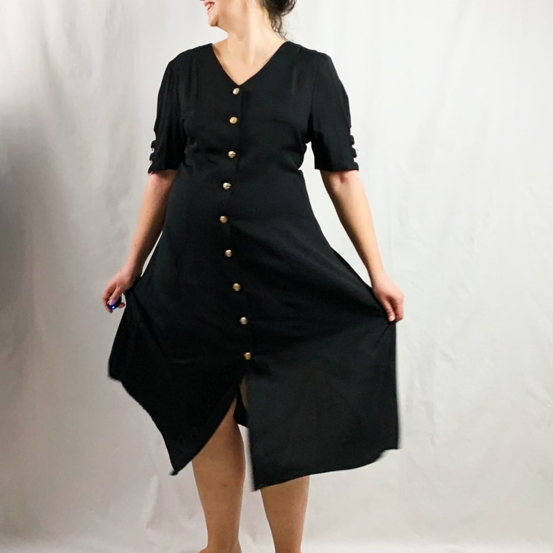 black dress with gold straps