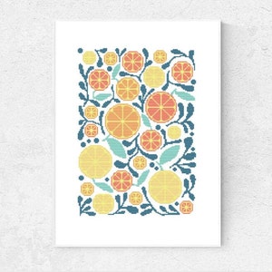 May include: A cross-stitch pattern featuring a colorful design of orange slices and leaves. The pattern is in shades of yellow, orange, red, blue, and green.