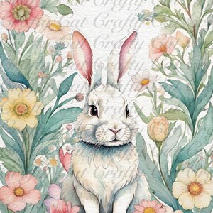 Peut inclure: Un lapin blanc aux oreilles roses est assis dans un nid de fleurs pastel et de feuilles vertes. Le lapin tient deux &oelig;ufs de P&acirc;ques, un jaune et un bleu.