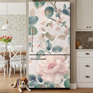 May include: A refrigerator with a floral design featuring large pink roses, teal and green leaves, and a light background. The design covers the entire front of the refrigerator, creating a decorative kitchen appliance.
