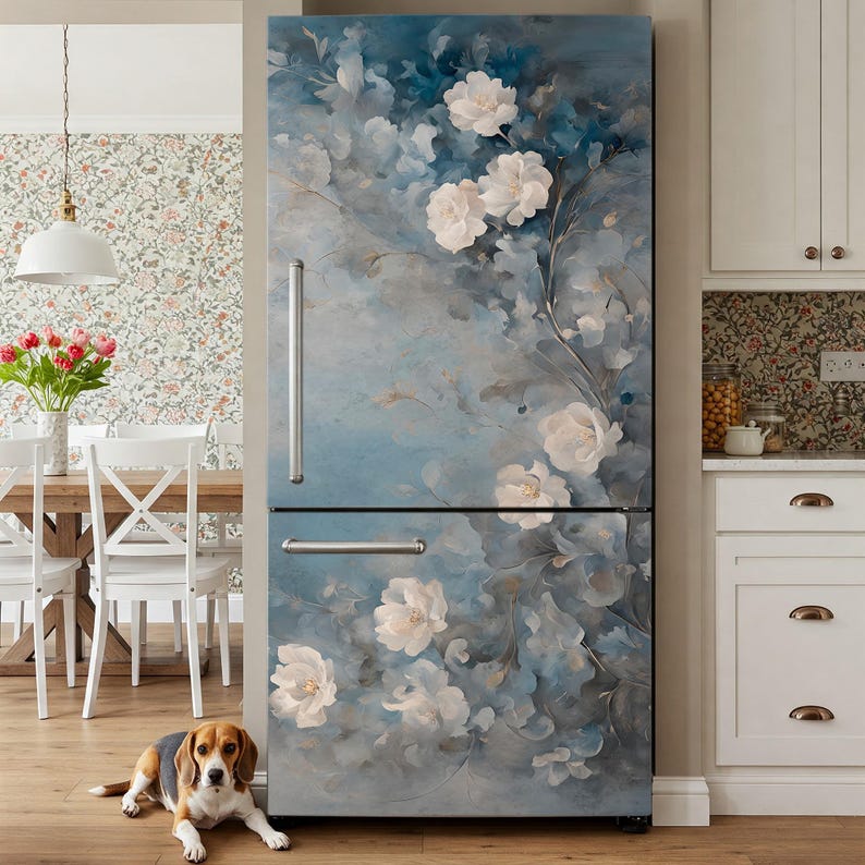 May include: A refrigerator door with a blue and white floral design. The design features white flowers with blue leaves and stems. The background is a light blue watercolor wash. The refrigerator is a stainless steel finish.