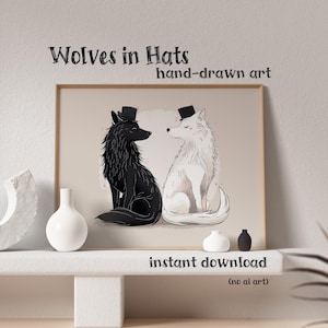 May include: A framed print featuring two wolves wearing top hats. One wolf is black, the other white, both sitting side-by-side. The artwork is labeled "Wolves in Hats" and "hand-drawn art". The words "instant download" are also visible.