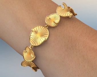 Pulsera de nenúfar de oro de 18 quilates o 18 k: joyería italiana con elementos trenzados