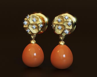 May include: A pair of gold earrings with a geometric design and a coral drop. The earrings are adorned with small diamonds.
