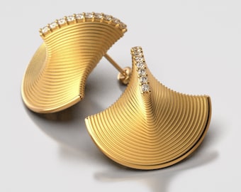 May include: A pair of gold earrings with a geometric design and a row of clear diamonds around the top edge.