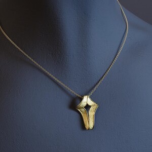 Contemporary cross pendant with rough matte finish and shiny borders