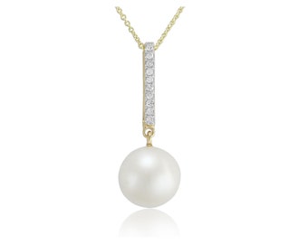 May include: A gold necklace with a single white pearl pendant and a diamond-encrusted bar.
