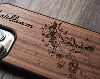 May include: A personalized wooden phone case with a laser-engraved design of a tree and the name "William".