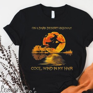 Women's On A DARK DESERT HIGHWAY Flying Witch Rock & Roll Old School Halloween Witch Graphic Tee T-Shirt plus size 4XL 5XL Avail