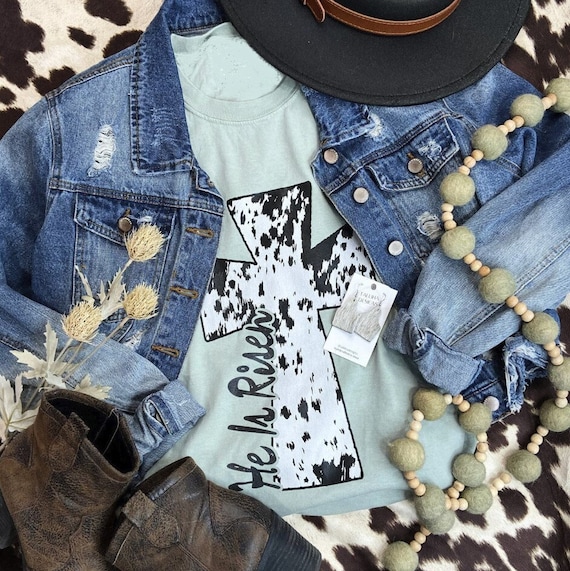Women's HE Is RISEN Cow Print CROSS Limited Cute Holiday Easter Passover Faith Christian Spring Graphic Tee Plus Size Avail in 3X 3XL 4X 4XL