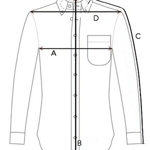 Op de afbeelding: Een witte button-down shirt met een zak, ge&iuml;llustreerd met zwarte lijnen die meetpunten aangeven. Het diagram toont metingen gemarkeerd met A, B, C en D, waarschijnlijk voor maatvoering. Het shirt heeft een klassieke kraag.