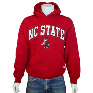 Size M. Vintage NC State 90s hooded sweatshirt made by Russell Athletic