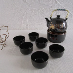 Tea service teapot teacup warmer black peacock motif