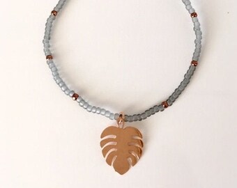 fine bracelet with small beads and pendant