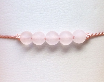 minimalist bracelet made of silk with rose quartz, macrame clasp
