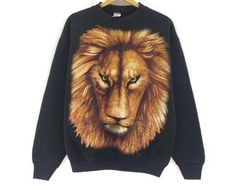 Sudadera vintage de los 90 Fruit Of The Loom con cuello redondo y manga larga, estampado de león y logo grande. Ropa vintage con estampado de animales y león. Color: negro / M