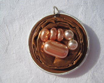 Stylish necklace pendant made from coffee capsules