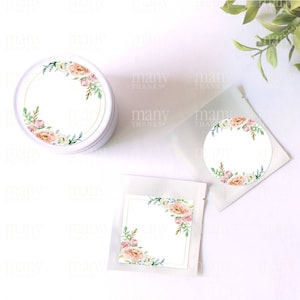 May include: Two round stickers with a floral design and a blank circle in the center. The stickers are on a white background. There is also a square sticker with a floral design in the corner and a blank rectangle in the center.