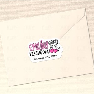 May include: Pink and white sticker with the text "Smelling good in the neighborhood!" and two pink hearts. The sticker also includes the website "manythanksco.etsy.com".