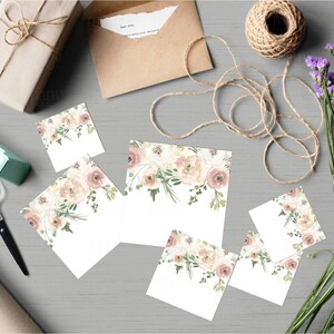 May include: Set of five blank cards featuring a watercolour floral design in shades of pink, white, and green. The cards are ideal for adding your own personal message.