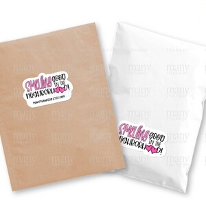 May include: A white sticker with pink hearts and the text "Smelling good in the neighborhood!" with the website "manythanksco.etsy.com" printed below.