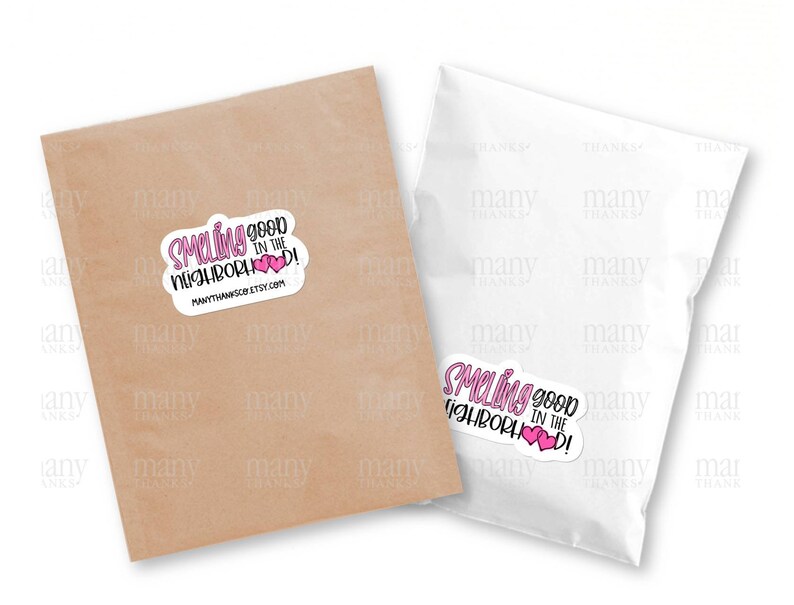 May include: A white sticker with pink hearts and the text "Smelling good in the neighborhood!" with the website "manythanksco.etsy.com" printed below.