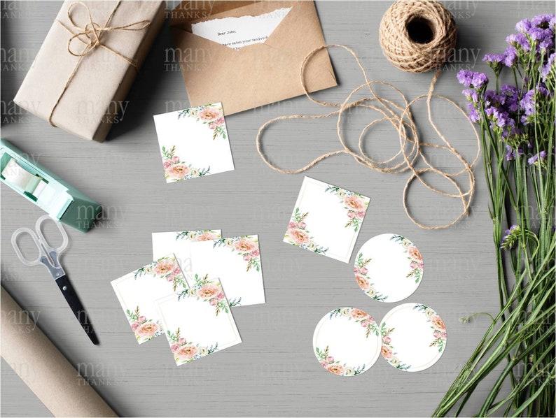 May include: A set of blank gift tags and labels with a floral design. The tags are white with a pink and green floral border. There are three round labels and four square labels.