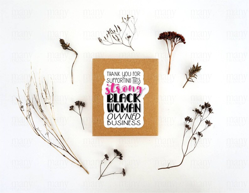 May include: A brown card with a white sticker that says "Thank you for supporting this strong Black woman owned business". The sticker has pink lettering for the word "strong".