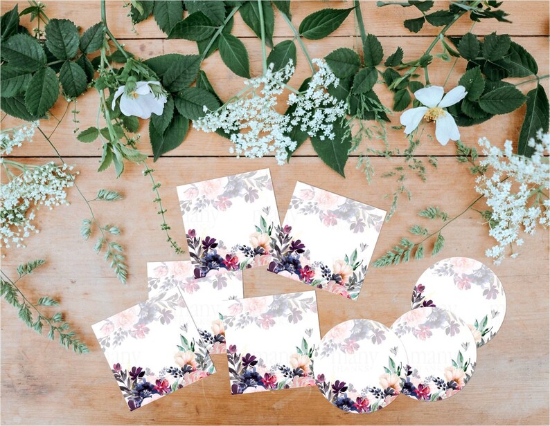 May include: Set of seven floral-themed gift tags and labels. The tags are square and the labels are round. The floral design features pink, purple, and green watercolor flowers on a white background.