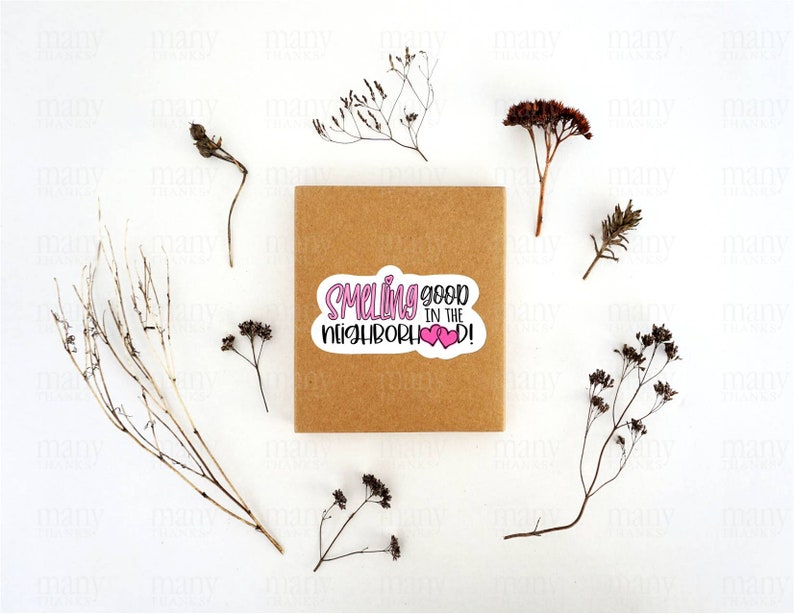 May include: A brown paper gift bag with a pink and white sticker that says "Smelling good in the neighborhood!" with two pink hearts.