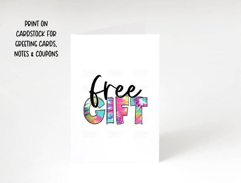 May include: A white card with the words "free gift" in black text. The letters are decorated with a colorful tie-dye pattern.