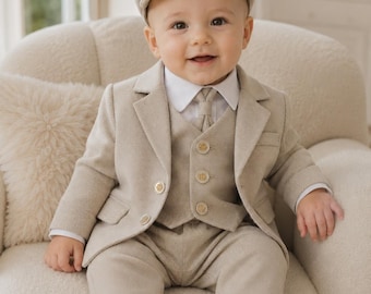 May include: A beige textured suit set consisting of a blazer, a button-up vest, and trousers. The outfit includes a white collared shirt, a matching necktie, and a flat cap. The blazer and vest feature light-colored buttons with a subtle design.