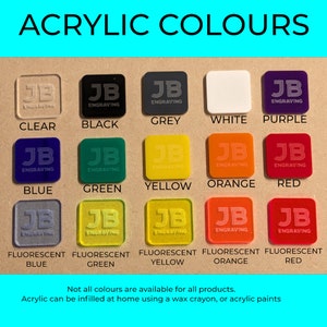 May include: A color chart of acrylic colors, including clear, black, grey, white, purple, blue, green, yellow, orange, and red. The chart also shows fluorescent blue, green, yellow, orange, and red. Each color sample has the text "JB Engraving". The text "ACRYLIC COLOURS" is at the top.