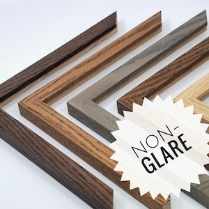 May include: A selection of wooden picture frame corners in shades of brown, grey, and natural wood. The frames are angled to show the corner details, with a white starburst graphic that reads "NON-GLARE".