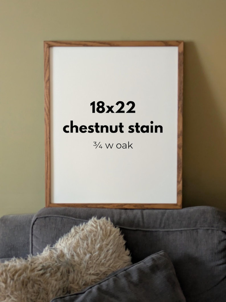 May include: A rectangular wooden picture frame with a chestnut stain and a 3/4 inch wide oak profile. The center of the frame contains white text that reads 18x22, chestnut stain, and 3/4 w oak, indicating the dimensions and material finish.