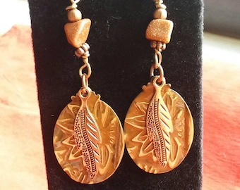 Handmade Goldstone metal embossed and feather dangle earrings "The money stone" great for manifesting and self esteem, beautiful, sparkly