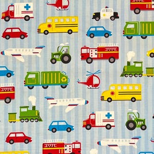 May include: A light blue fabric with a repeating pattern of various vehicles, including ambulances, school buses, fire trucks, cars, airplanes, helicopters, tractors, and trains. The vehicles are in bright colors against a background of vertical white stripes.
