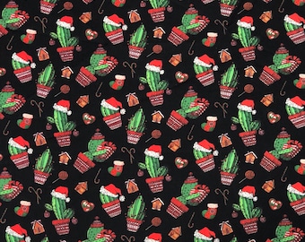 May include: Black fabric with a repeating pattern of green cacti wearing Santa hats, red and white candy canes, gingerbread houses, and red and white candy hearts.